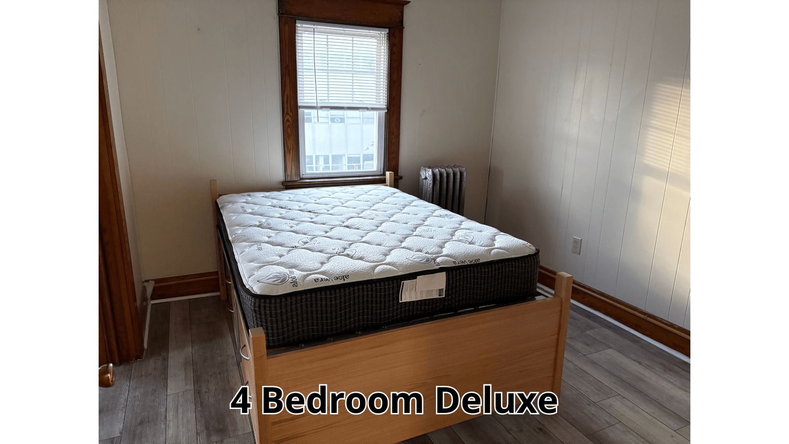4 Bedroom Deluxe bed and window