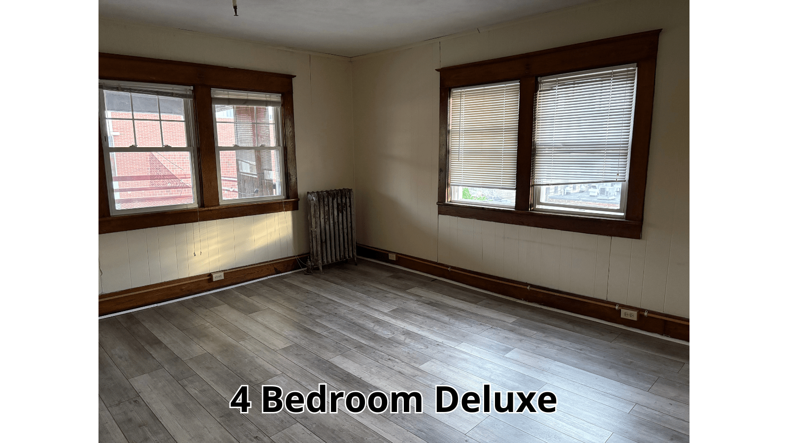 Empty room with wood trim and blinds