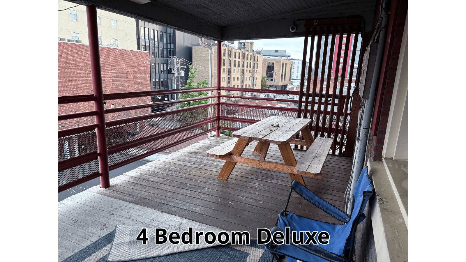 Balcony with picnic table and chairs