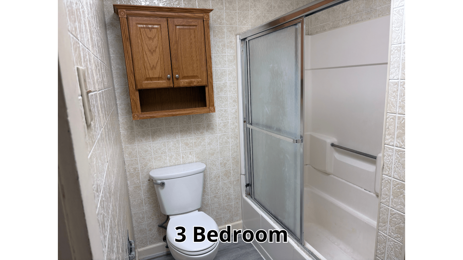 3 Bedroom bathroom with toilet and shower
