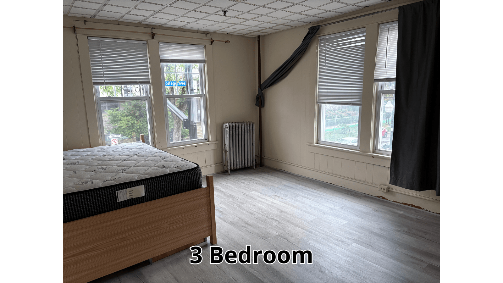 Empty bedroom with bed and windows