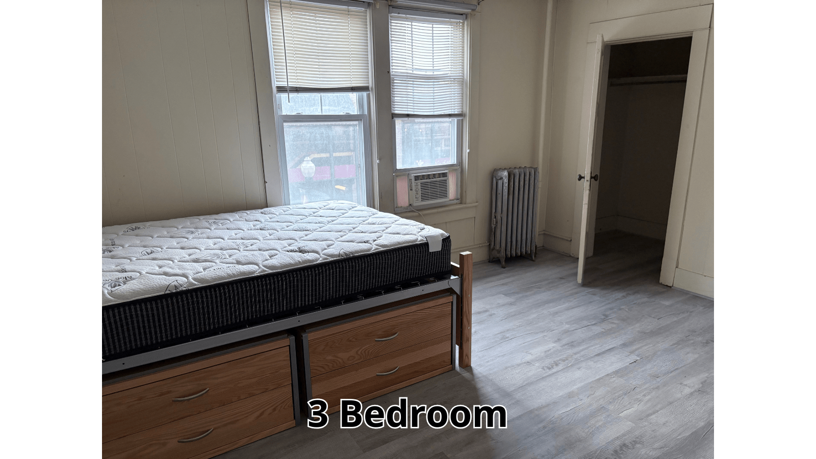Bedroom with bed, window, and closet