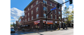 a red brick building on the corner of a street