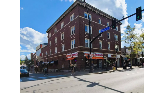 a red brick building on the corner of a street
