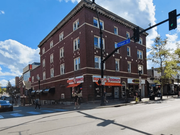 a red brick building on the corner of a street