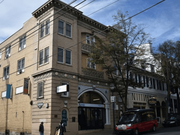 Exterior of tan brick building