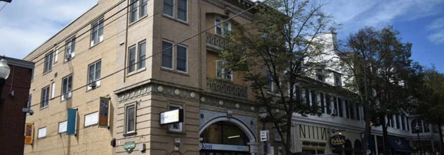 Exterior of tan brick building