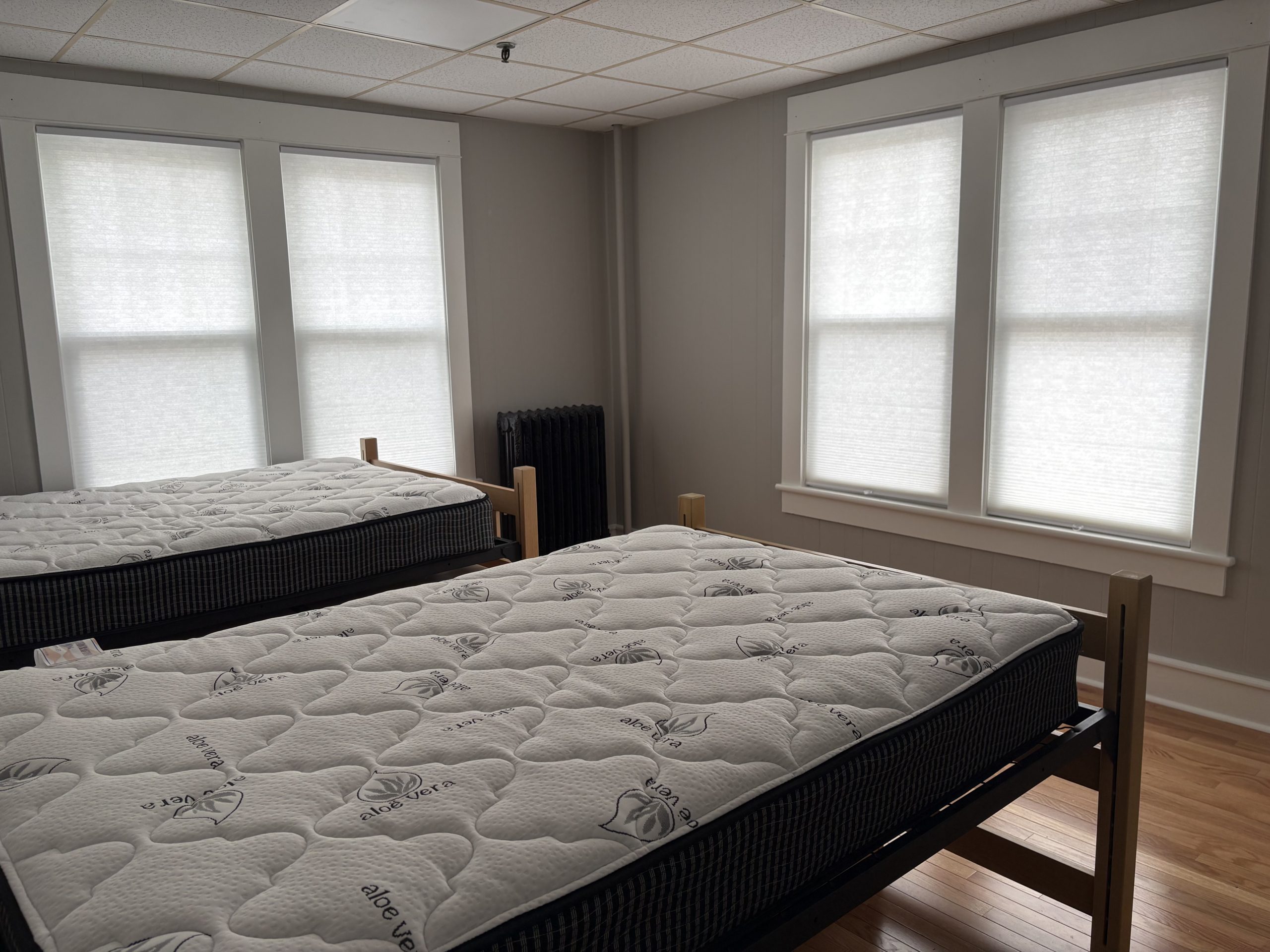 Two mattresses on bed frames