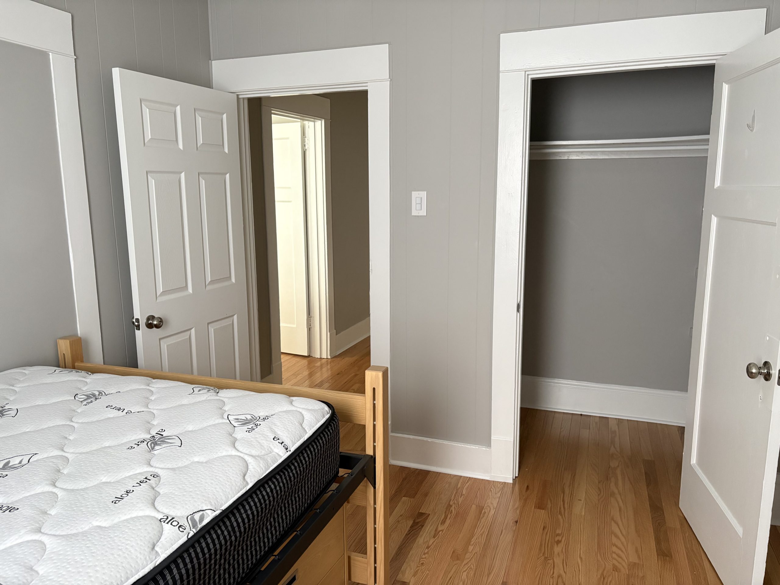 Bedroom with bed and open doors