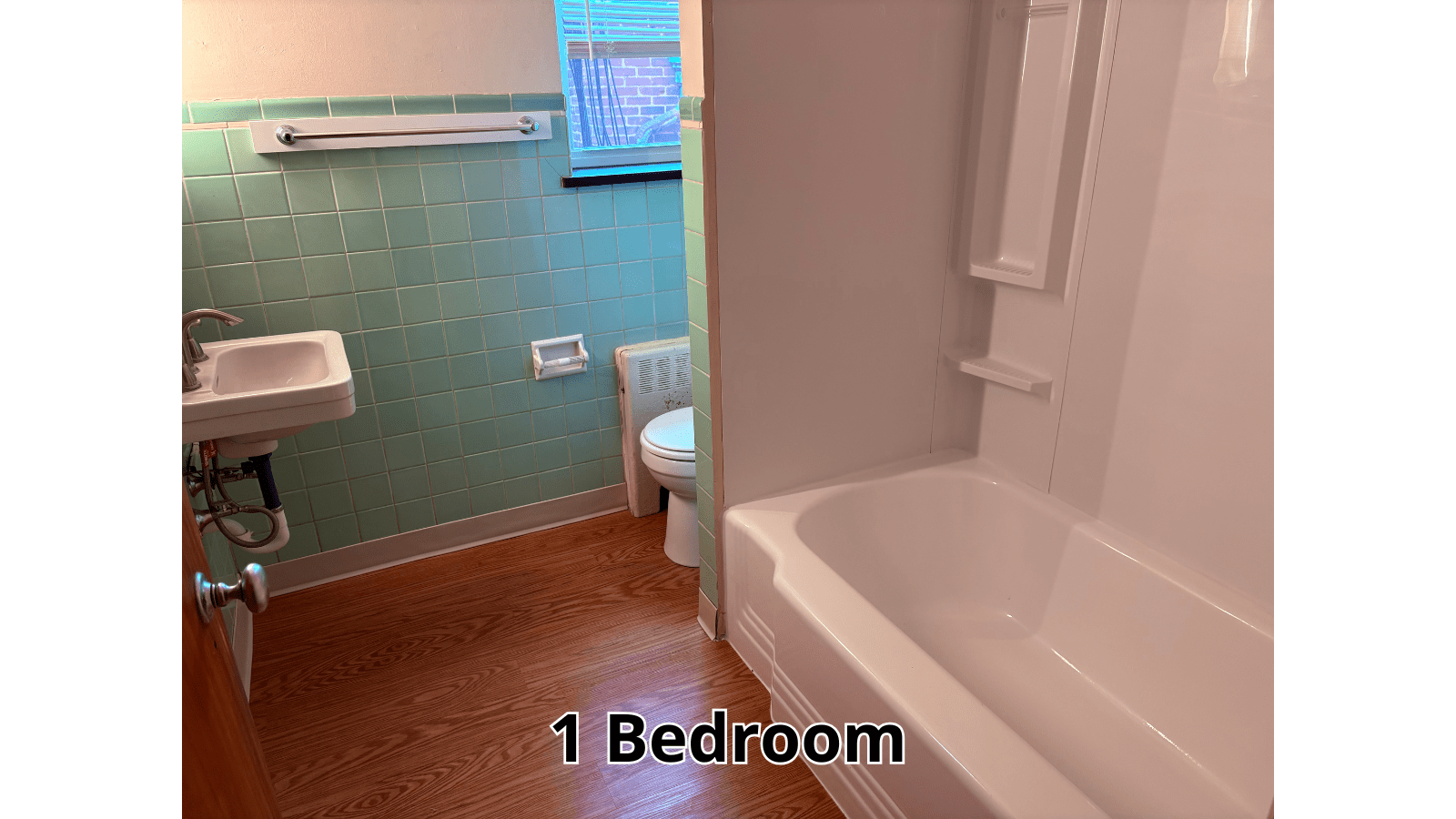 Bathroom with tub, toilet, and sink