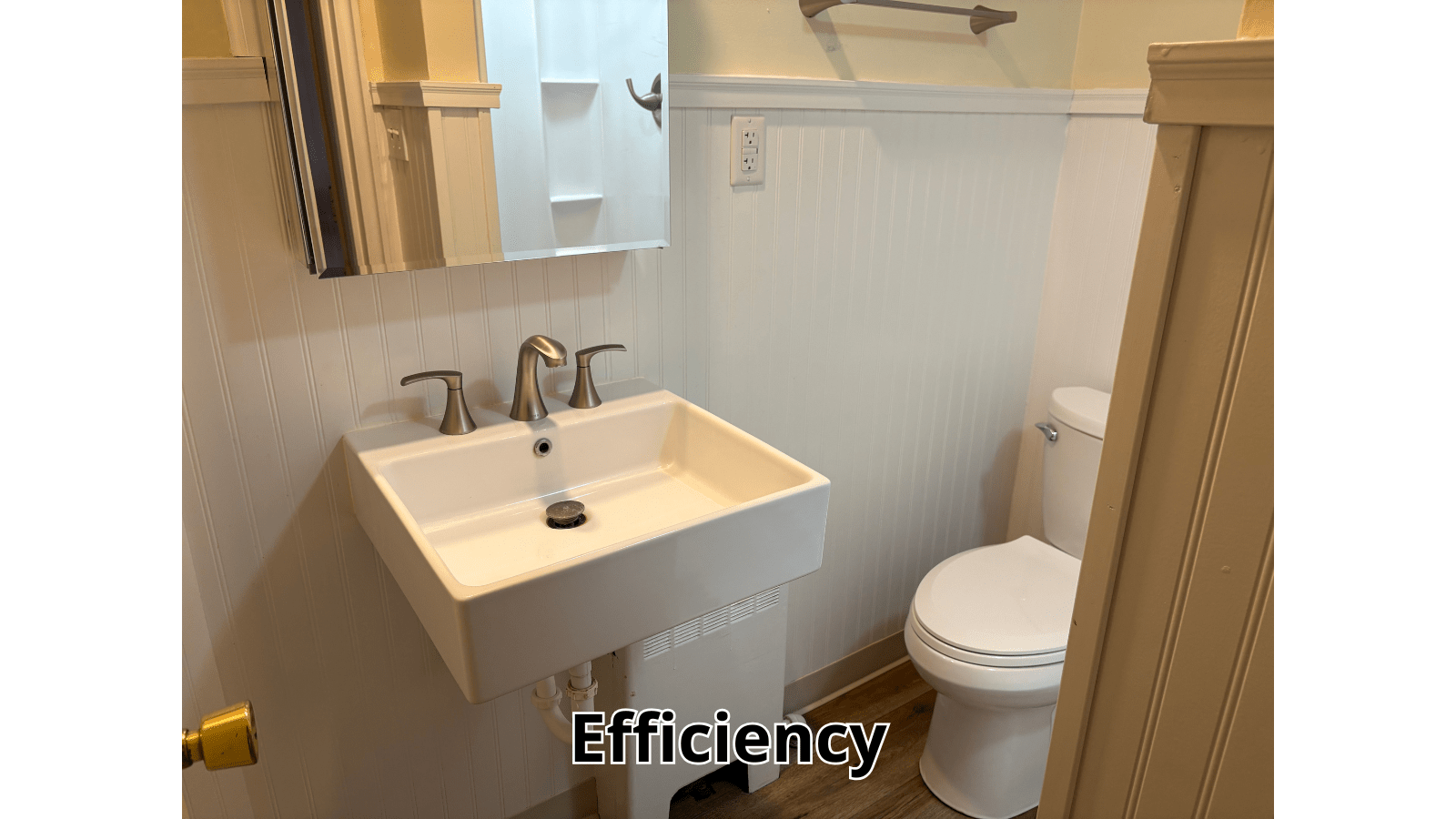 Small efficient bathroom with sink and toilet