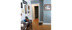 Entryway with table and pictures