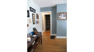 Entryway with table and pictures