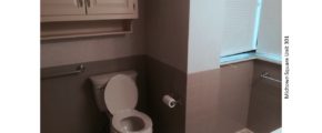 Bathroom with toilet and cabinetry