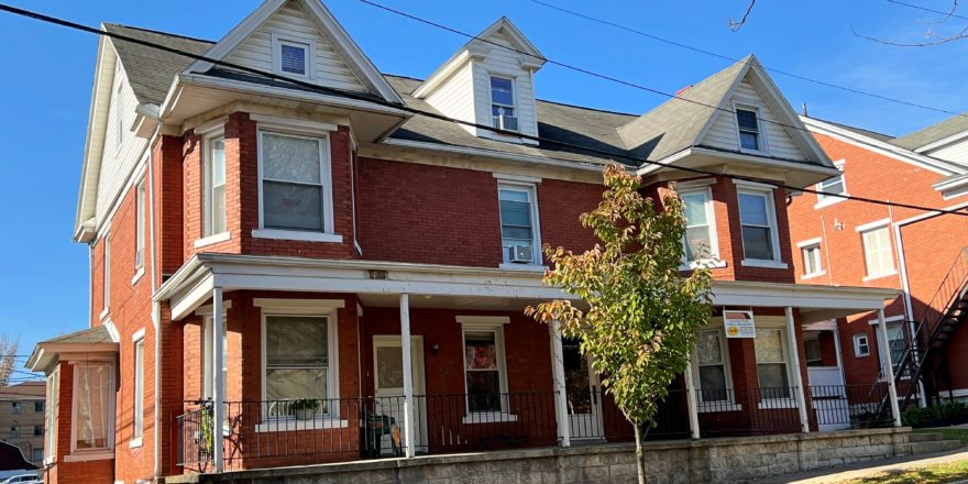 Exterior of a brick, two-story duplex house