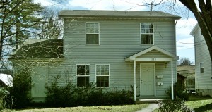 Exterior of house with siding and covered front porch