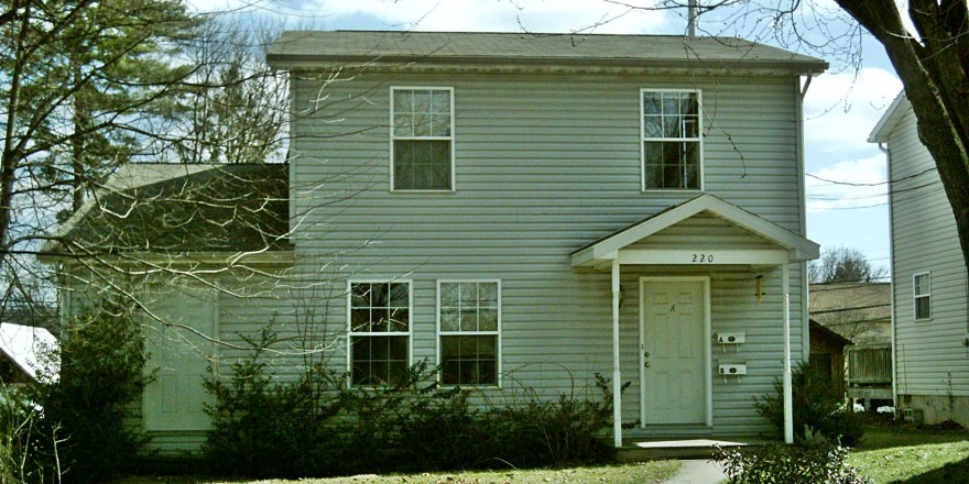 Exterior of house with siding and covered front porch