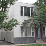 Exterior of two-story building with stucco