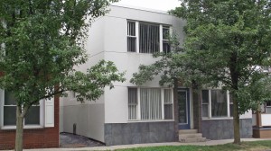 Exterior of two-story building with stucco