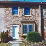 Exterior of a townhome with multi-colored bricks
