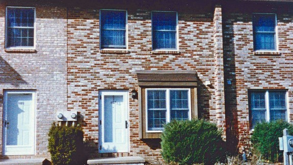 Exterior of a townhome with multi-colored bricks