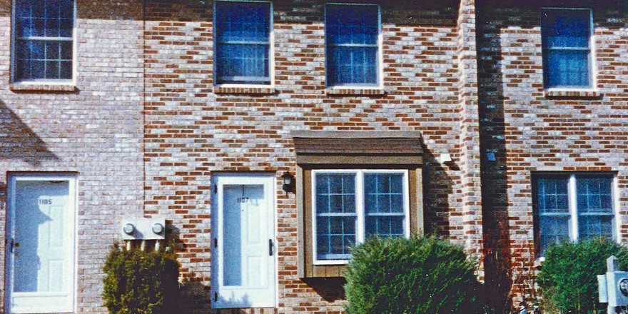 Exterior of a townhome with multi-colored bricks