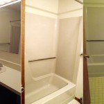 Bathroom with tub/shower combo, toilet, and vanity