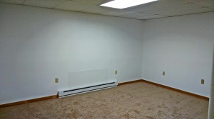 Unfurnished, carpeted living room