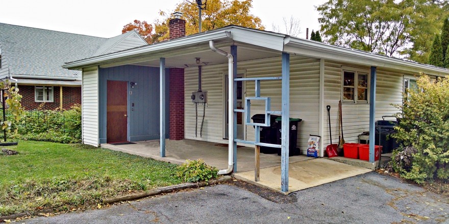 Carport with blue and white siding