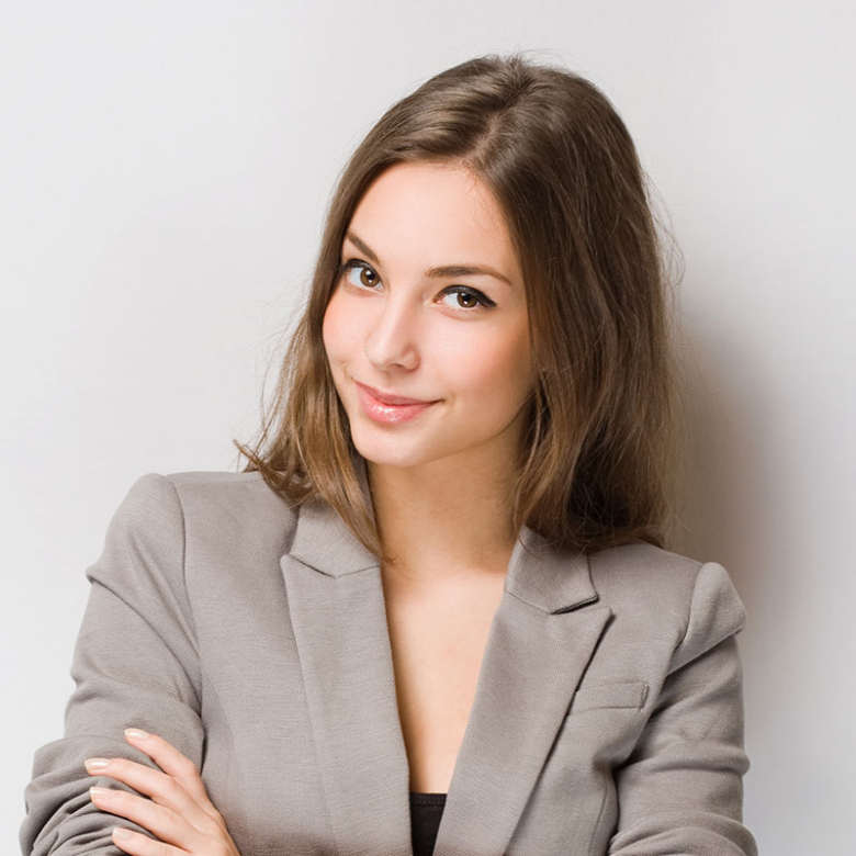 a woman with her arms crossed posing for a picture