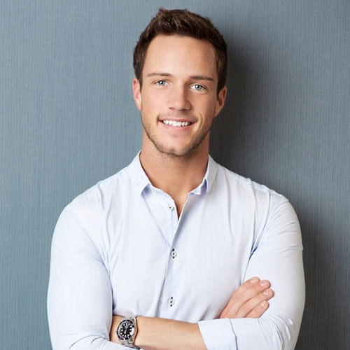 a man in a white shirt is posing for a picture