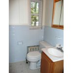 Bathroom with vanity, toilet, and medicine cabinet