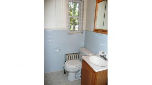 Bathroom with vanity, toilet, and medicine cabinet