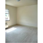 Unfurnished carpeted bedroom