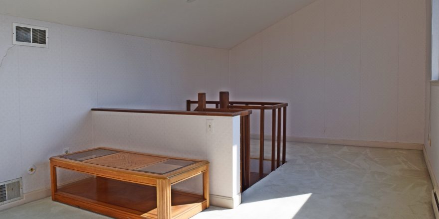 Multi-purpose attic office space. Stairs coming up in to the middle of the room.