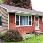 Exterior of ranch house with brick and siding