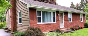 Exterior of ranch house with brick and siding