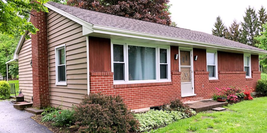 Exterior of ranch house with brick and siding