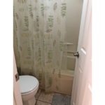 Bathroom with toilet and tub/shower combo