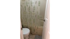 Bathroom with toilet and tub/shower combo