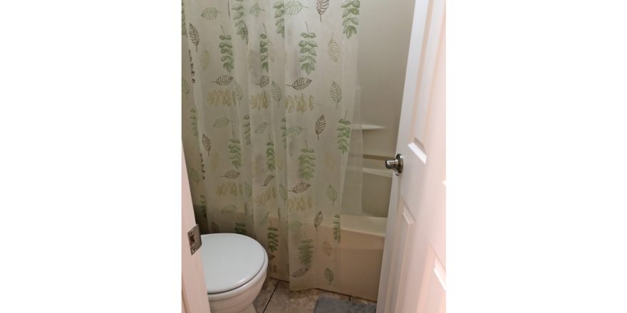 Bathroom with toilet and tub/shower combo