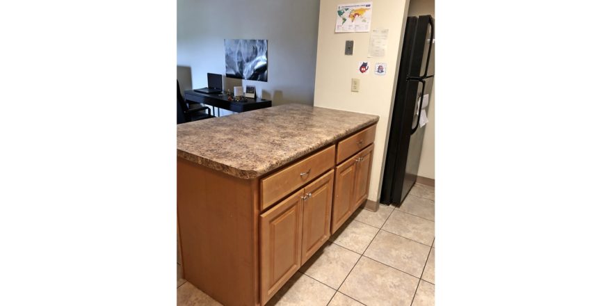 Kitchen island and black fridge