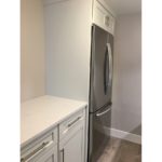 Kitchen with fridge and cabinets