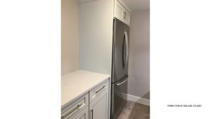 Kitchen with fridge and cabinets