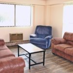 Living Room with couches, recliners, accent tables, and wood-style flooring