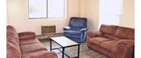 Living Room with couches, recliners, accent tables, and wood-style flooring