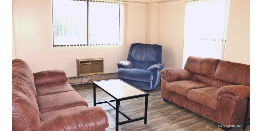 Living Room with couches, recliners, accent tables, and wood-style flooring