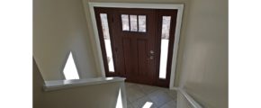 Split entry with wood door and carpets stairs