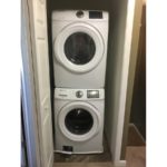Laundry closet with stackable washer and dryer