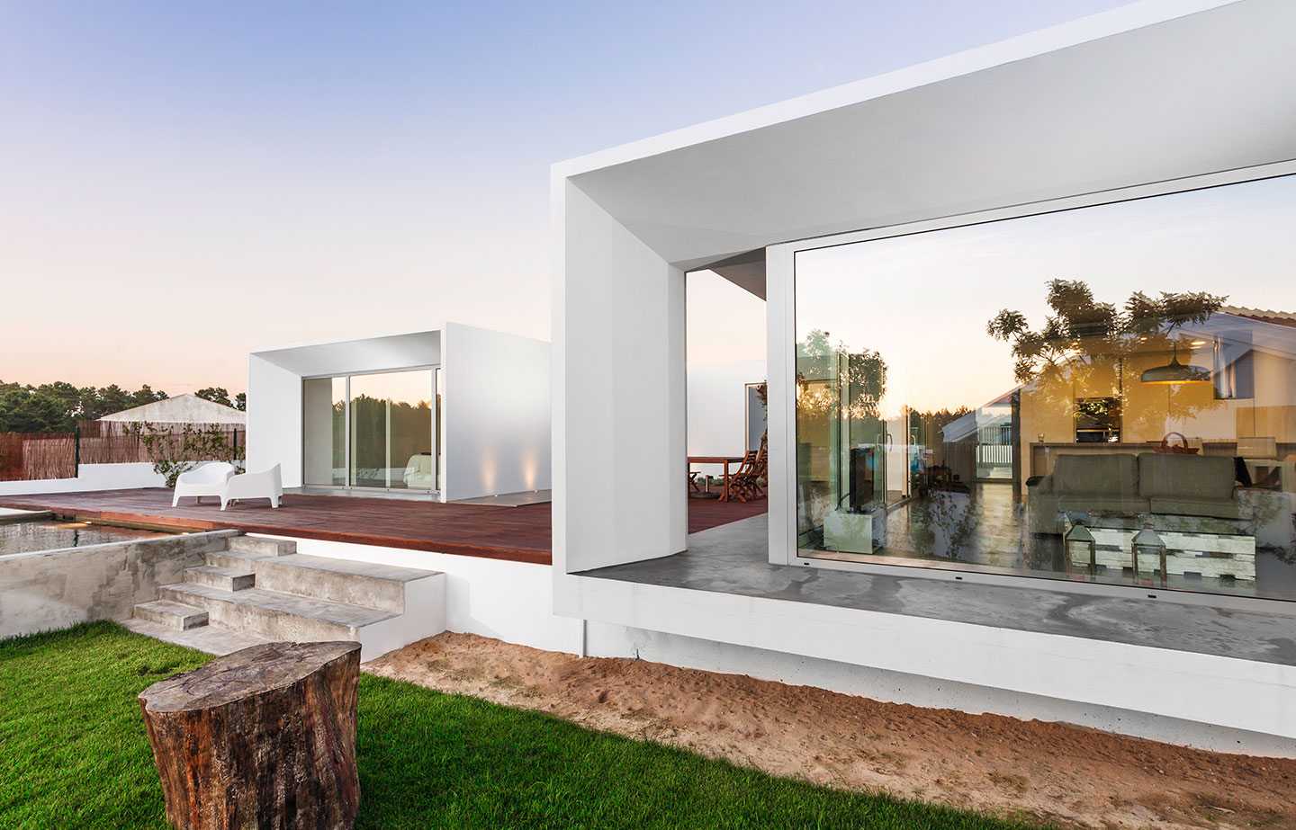 a house with a large glass window on the side of it